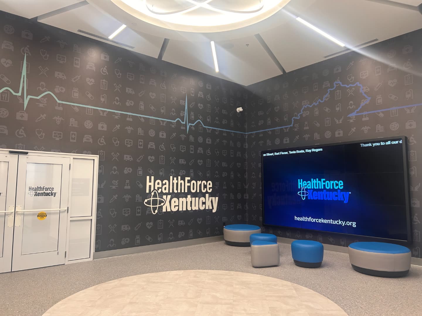 HealthForce Kentucky lobby with illuminated wall sign and Kentucky outline